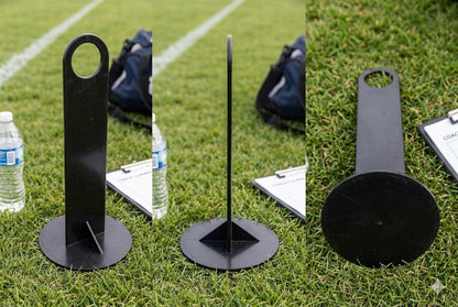 Three views of a black metal flagstick or signal flag stand on a green grass field, with water bottles and bags visible in the background.